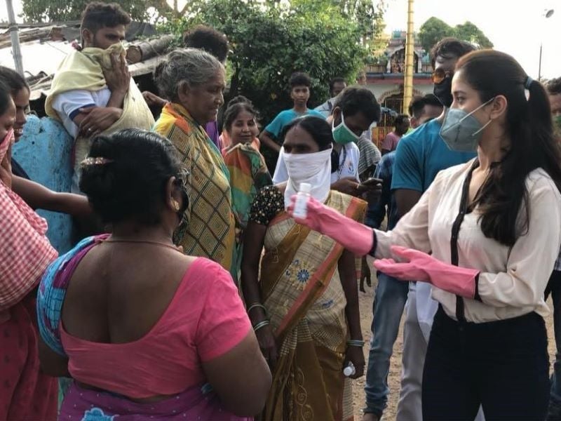 Elina Samantaray distributing hand sanitisers