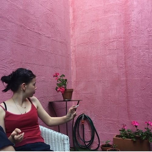 Ella Newton smoking a cigarette