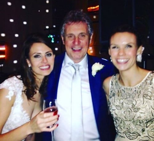 Ellie Taylor holding a glass of alcohol