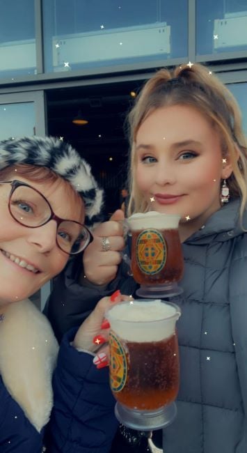 Eloise Milburn holding a mug of beer