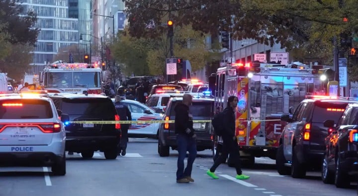 Emergency vehicles gathered at a cordoned off area where National Guard soldiers were shot near the White House