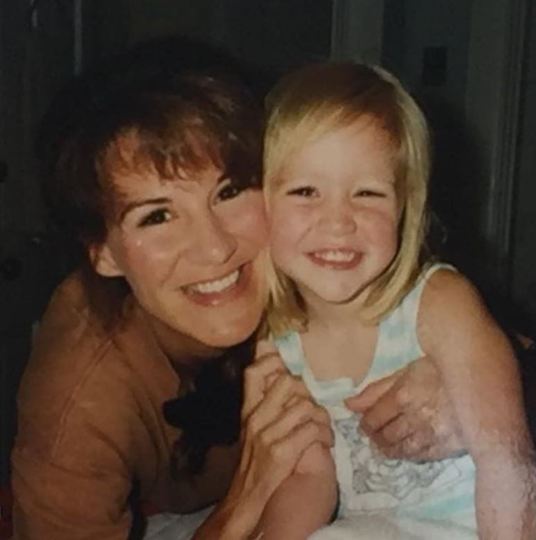Emily Mayfield in childhood with her mother