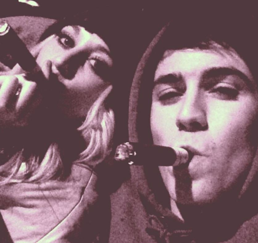 Emily Mayfield smoking a cigar