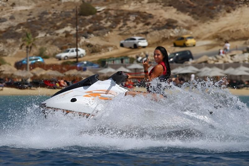 Emily Shah enjoying a thrilling moment while jet skiing in Greece