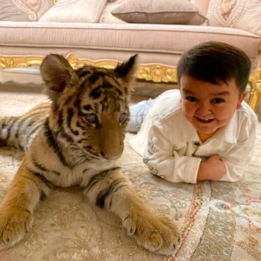 Erali Boyqobilov with his pet cub