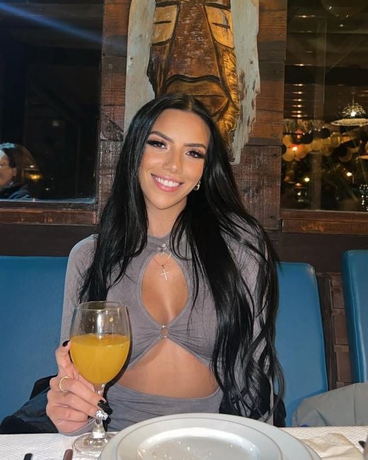 Erica Reis with a glass of alcohol