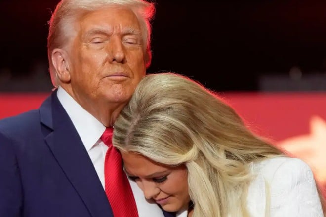 Erika Kirk while hugging Donald Trump at the religious prayer for Charlie at State Farm Stadium in Arizona