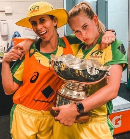 Erin Burns and Maitlan Brown with the Rose Bowl Trophy