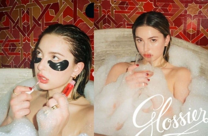 Eve Jobs in a Glossier holiday campaign with Sydney Sweeney