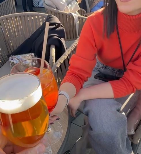 Fabrizio Mileto drinking beer with his girlfriend