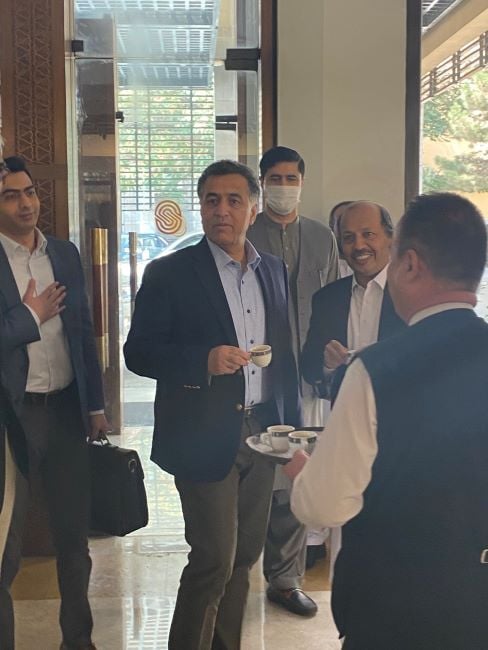 Faiz Hameed drinking tea while visiting Afghanistan