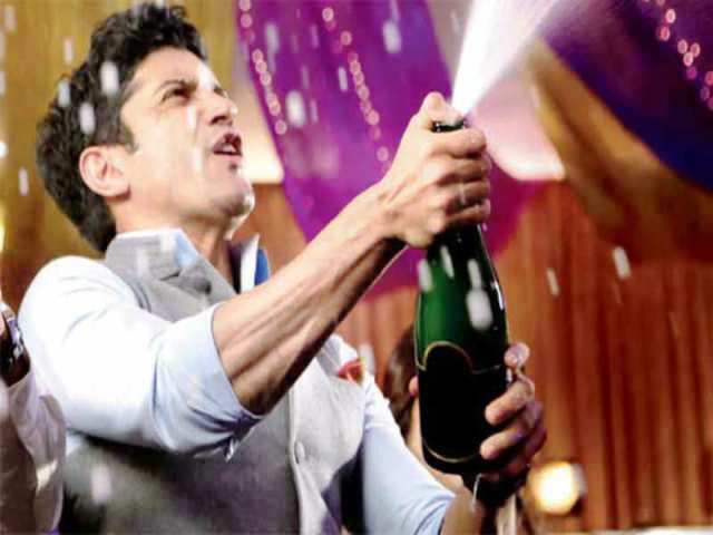 Farhan Akhtar with a bottle of alcohol