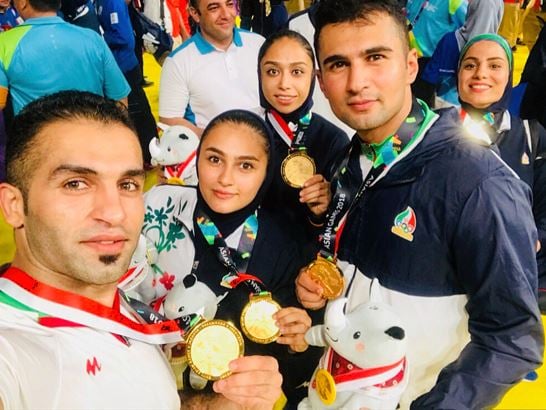 Fazel Atrachali (extreme left) after winning the final of the 2018 Asian Games