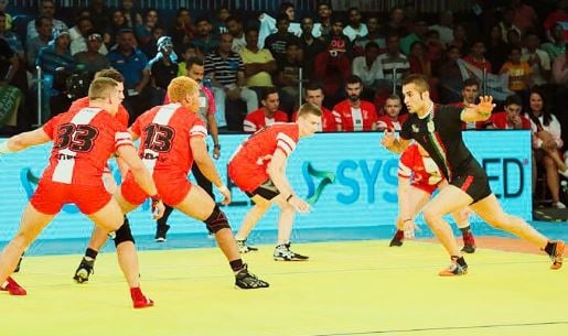 Fazel Atrachali (in black) playing in the 2016 Kabaddi World Cup