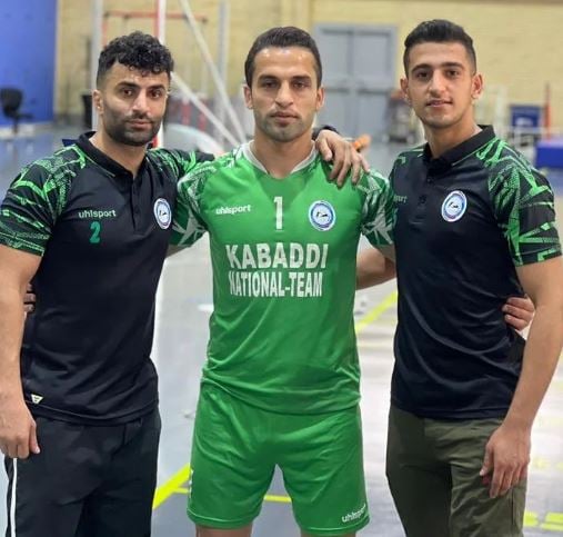 Fazel Atrachali (in green) during a national tournament in Iran