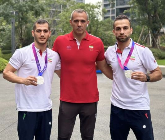 Fazel Atrachali (right) with Gholamreza Mazandarani (in red)