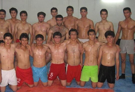 Fazel Atrachali (standing, second from right) during his early Kabaddi training