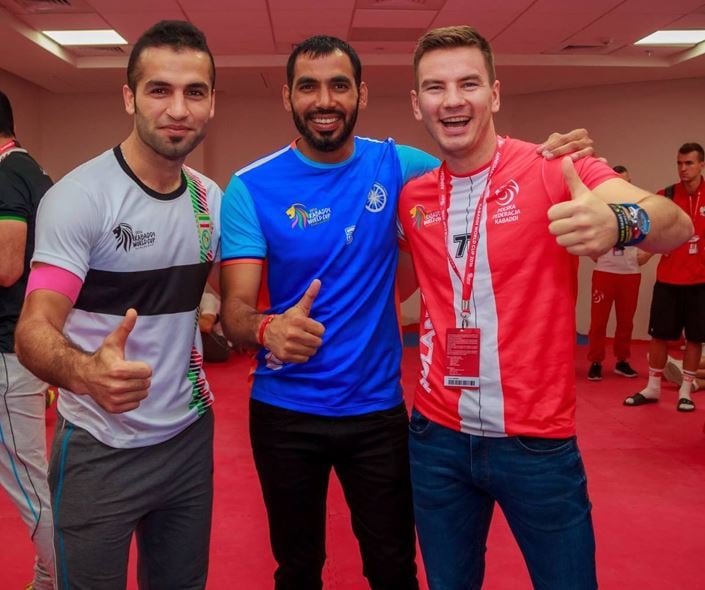 Fazel Atrachali with Anup Kumar and Michal Spiczko (left to right) during the 2016 Kabaddi World Cup