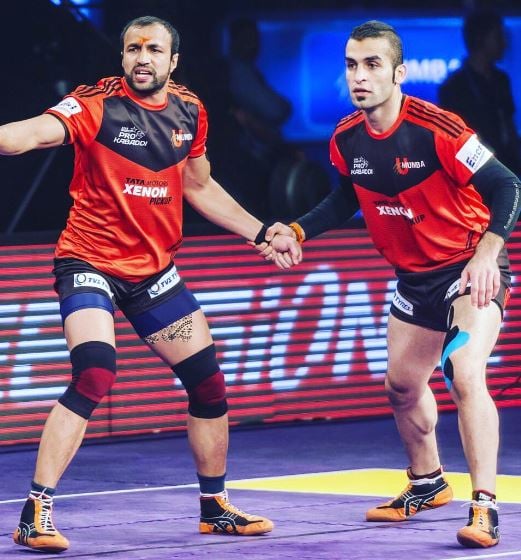 Fazel Atrachali with Rakesh Kumar (left) playing in a PKL match for U Mumba