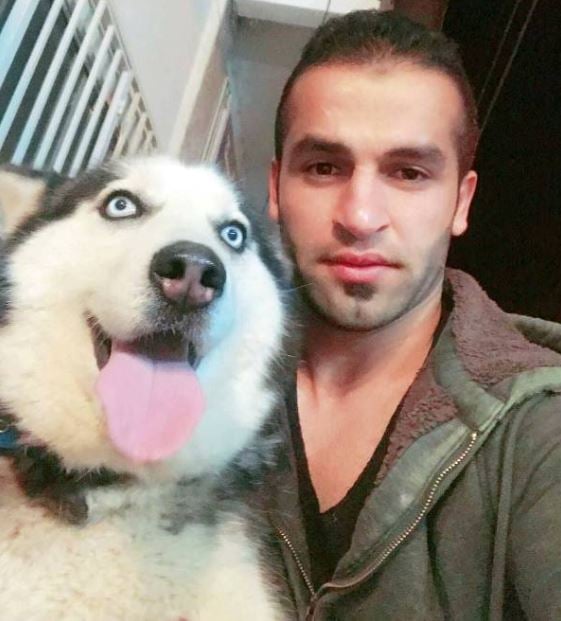 Fazel Atrachali with his pet dog