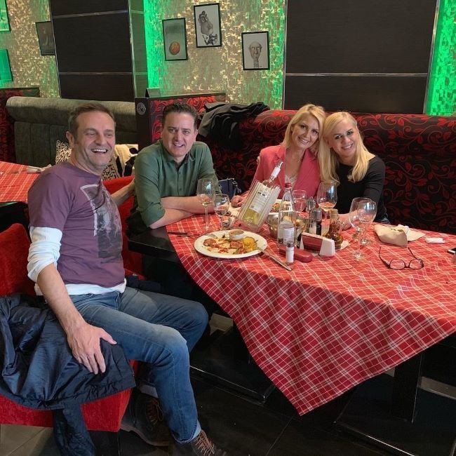 Fevzije Berani with a glass of alcohol