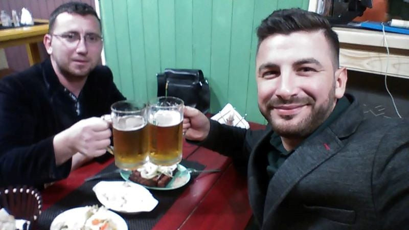 Florian Carkanji holding a mug of beer