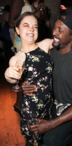 Francesca Mills holding a glass of wine