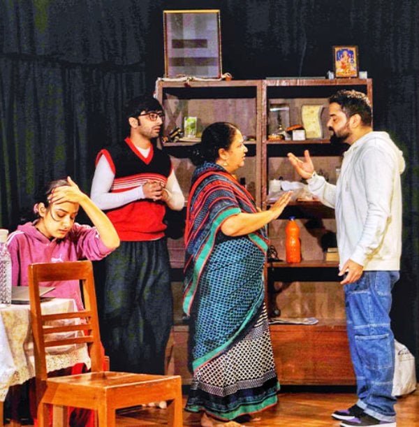 From left to right, actors Chakori Dwivedi, Abhishek Chauhan, Rasika Agashe, and Niketan Sharma in a scene from the play Photo-Copy (2022)