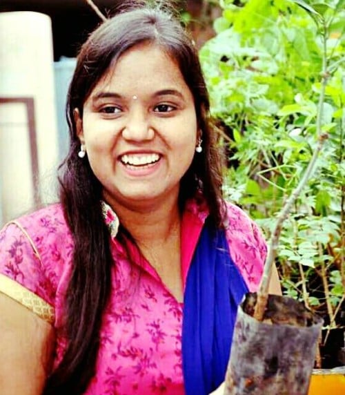 G. Lasya Nanditha while planting a sapling