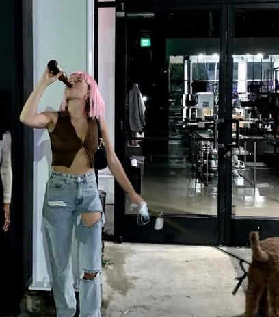 Gabby Windey while enjoying beer