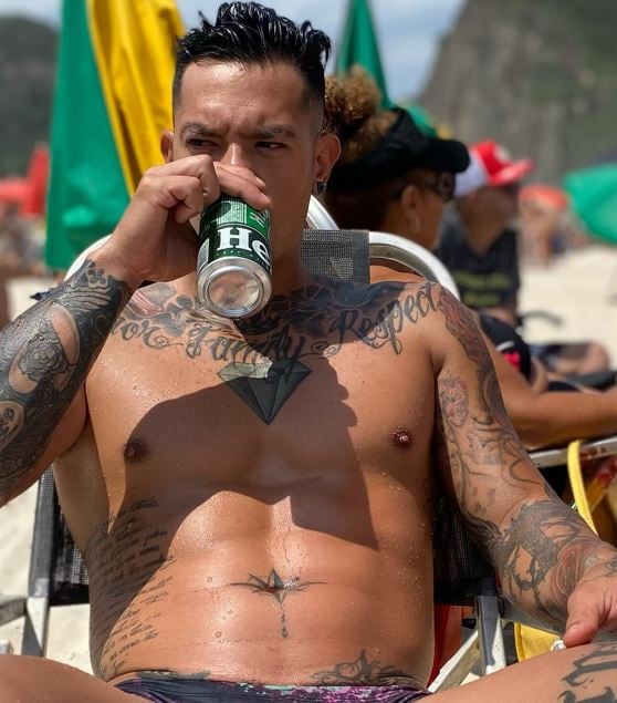 Gabriel Yoshimoto drinking beer during a party