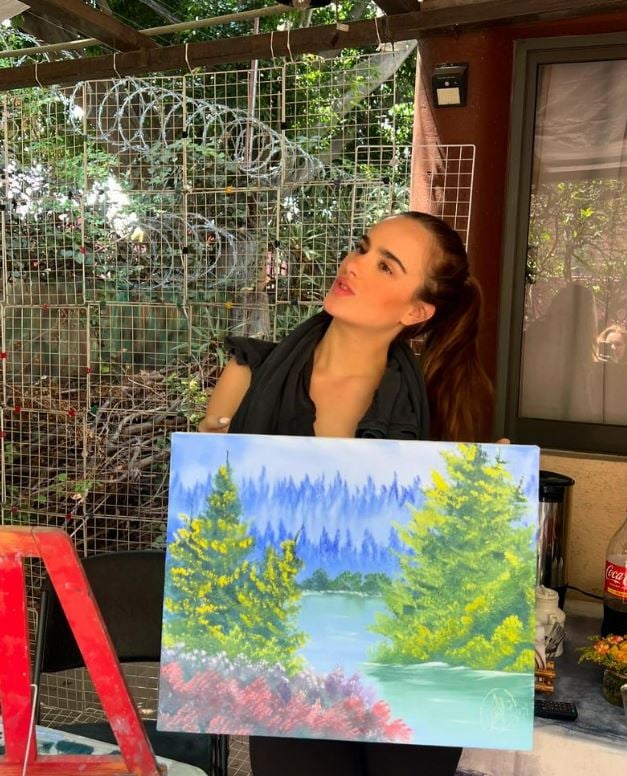 Gala Montes with her painting