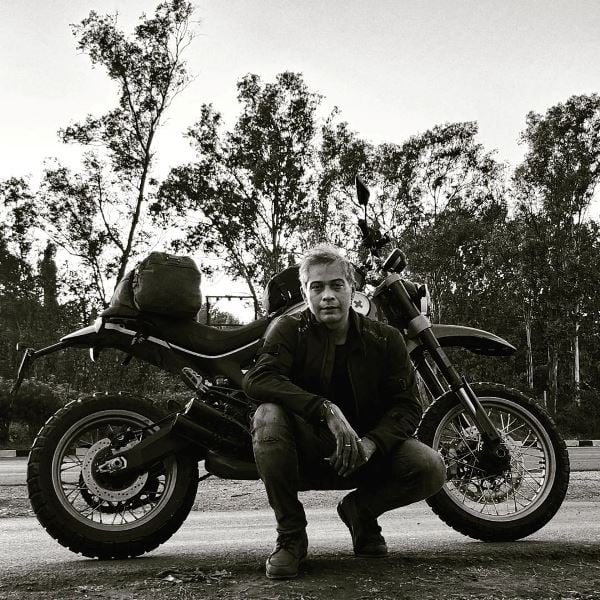 Gaurav K. Sharma posing with his bike