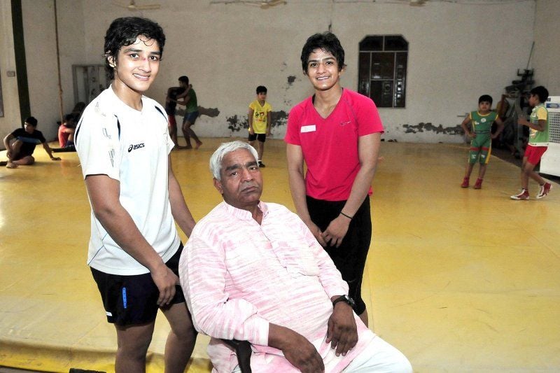Geeta and Babita with their father Mahavir Singh Phogat