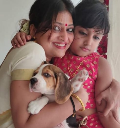 Geetu Mohandas with her daughter and pet dog