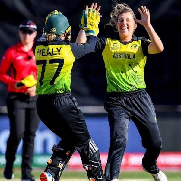 Georgia Wareham celebrating the fall of a wicket with her teammate