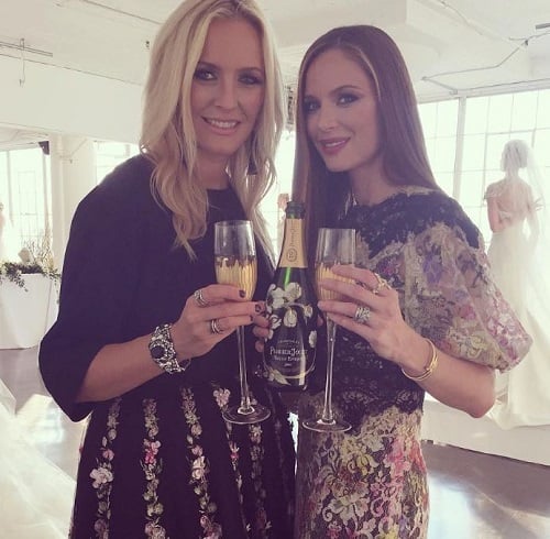 Georgina Chapman holding a glass of alcohol