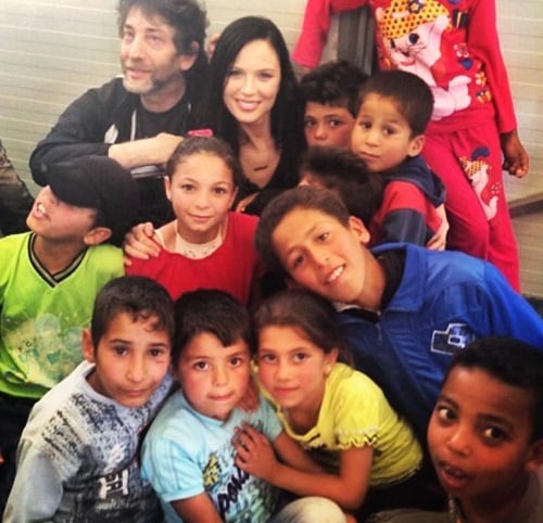 Georgina Chapman with the children of a refugee camp