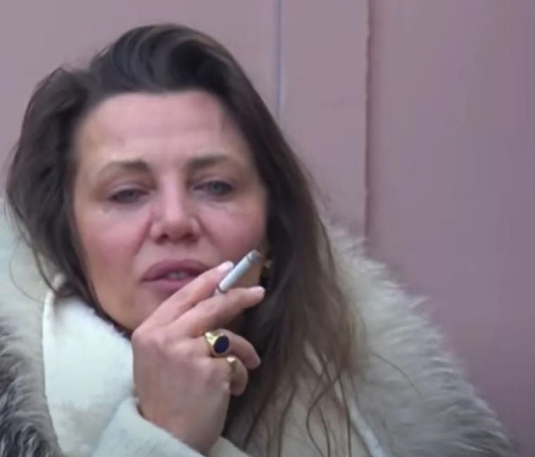 Gerta Gixhari smoking a cigarette