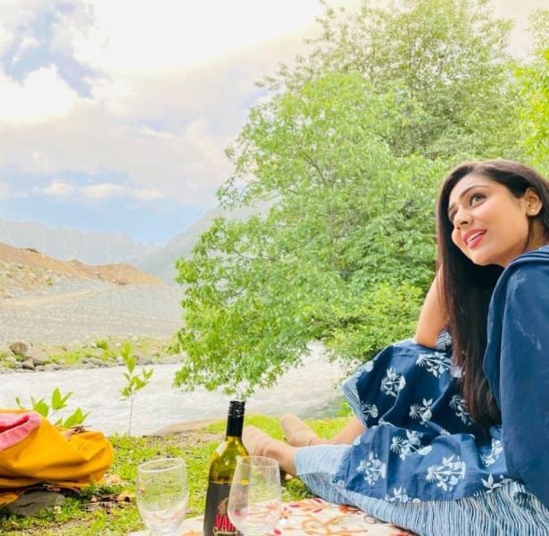 Ghazal with a bottle and glasses of wine