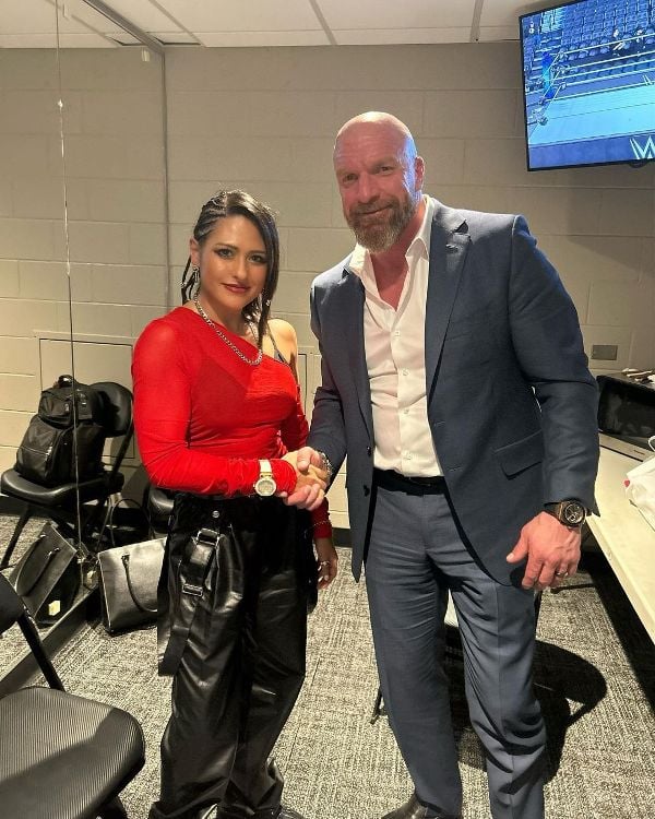 Giulia with Triple H after she joined WWE