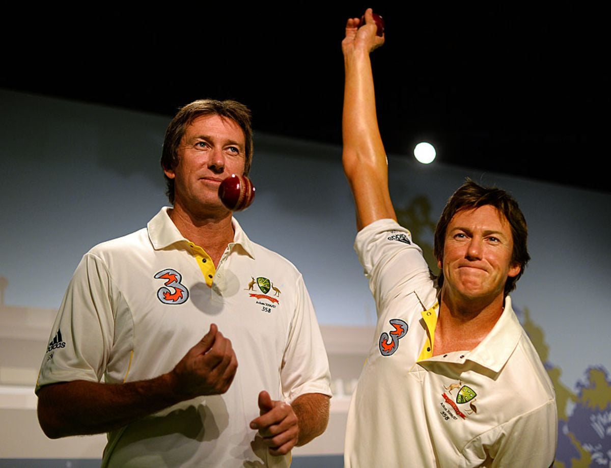 Glenn Mcgrath poses with his statue at Madame Tussaud