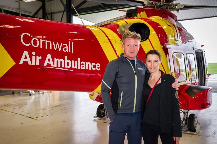 Gordon Ramsay and Tana Hutcheson standing in front of the Cornwall Air Ambulance