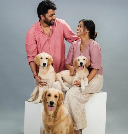 Gouthami Jadav with her husband and three dogs