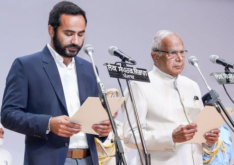 Gurmeet Singh Meet Hayer while taking oath as a Cabinet Minister at the Guru Nanak Dev Auditorium in Punjab Raj Bhavan, Chandigarh