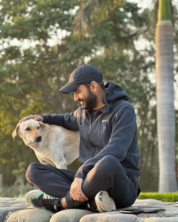 Gurmeet Singh Meet Hayer with a dog