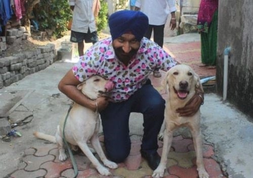 Gurucharan Singh with dogs