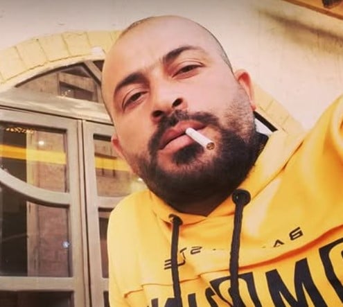 Hamdan Ballal while smoking a cigarette