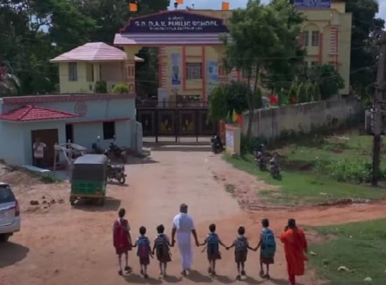 Hare Ram Pandey while dropping his adopted girls at a school in Jharkhand