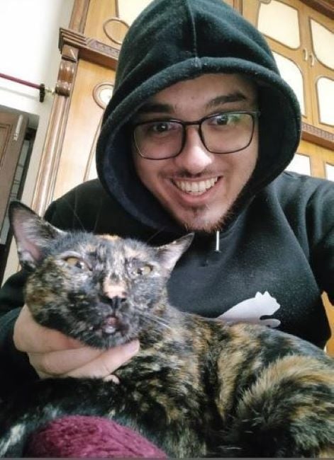 Haris Ali Khan playing with his cat